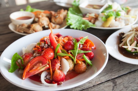 Strawberry spicy salad on white plate, Spacial menu in Thailand